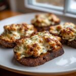 Five servings of the hanky panky recipe served hot on toasted dark bread, topped with melted, browned cheese.