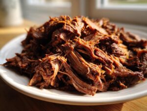 Close-up of richly seasoned, shredded meat ready to be used in a homemade doner kebab.